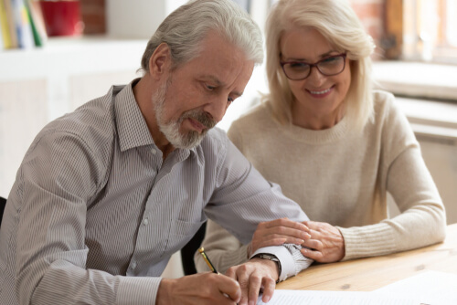 elderly couple writing will